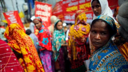 Garment workers who survived the Rana Plaza building collapse take part in a protest to demand for compensation, on the six month anniversary of the incident, in front of the site in Savar